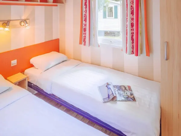 Camera Roan Comfort Plus Relax con due letti singoli.